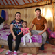 Davaadulam Jangalsaikhen, Sukhbayar Enkhjakfel, and their daughter Sendor Sukhbayar in their home in Ulaanbaatar.